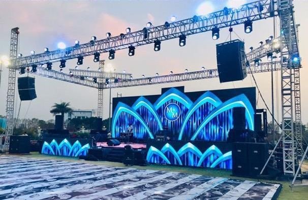 LED backdrop and line array setup, wedding reception